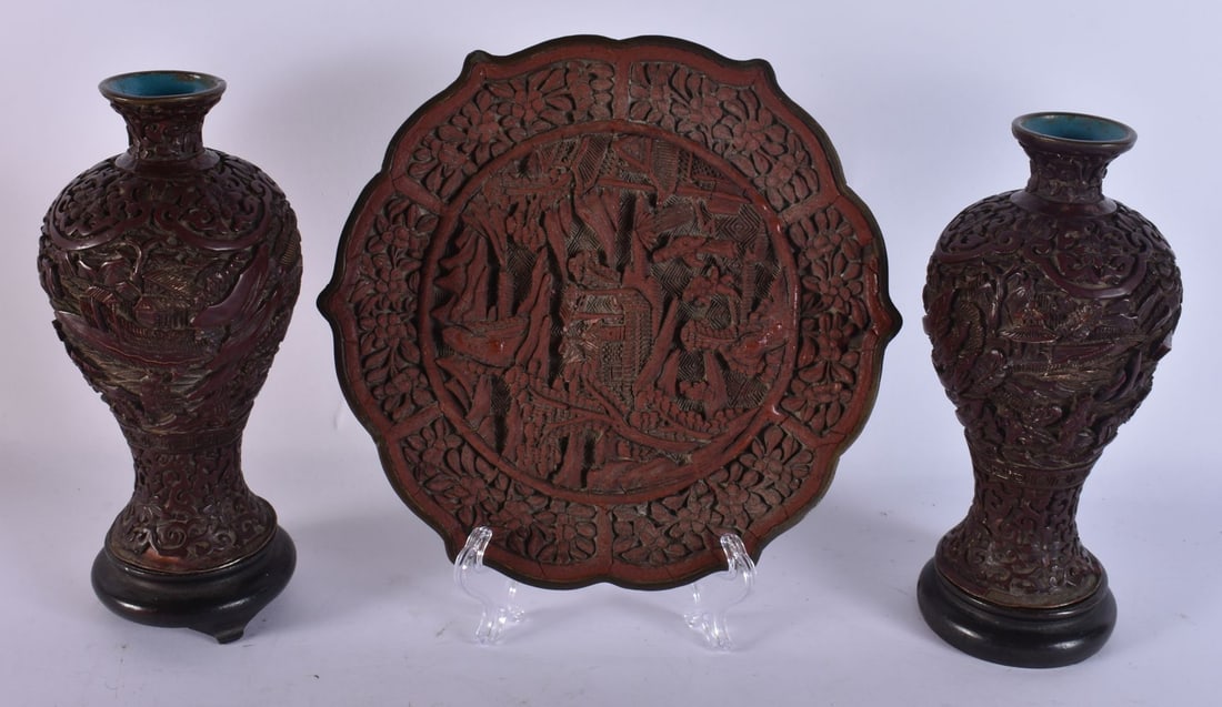 A 19TH CENTURY CHINESE CINNABAR LACQUER DISH together with a pair of vases. (3) (1 of 4)