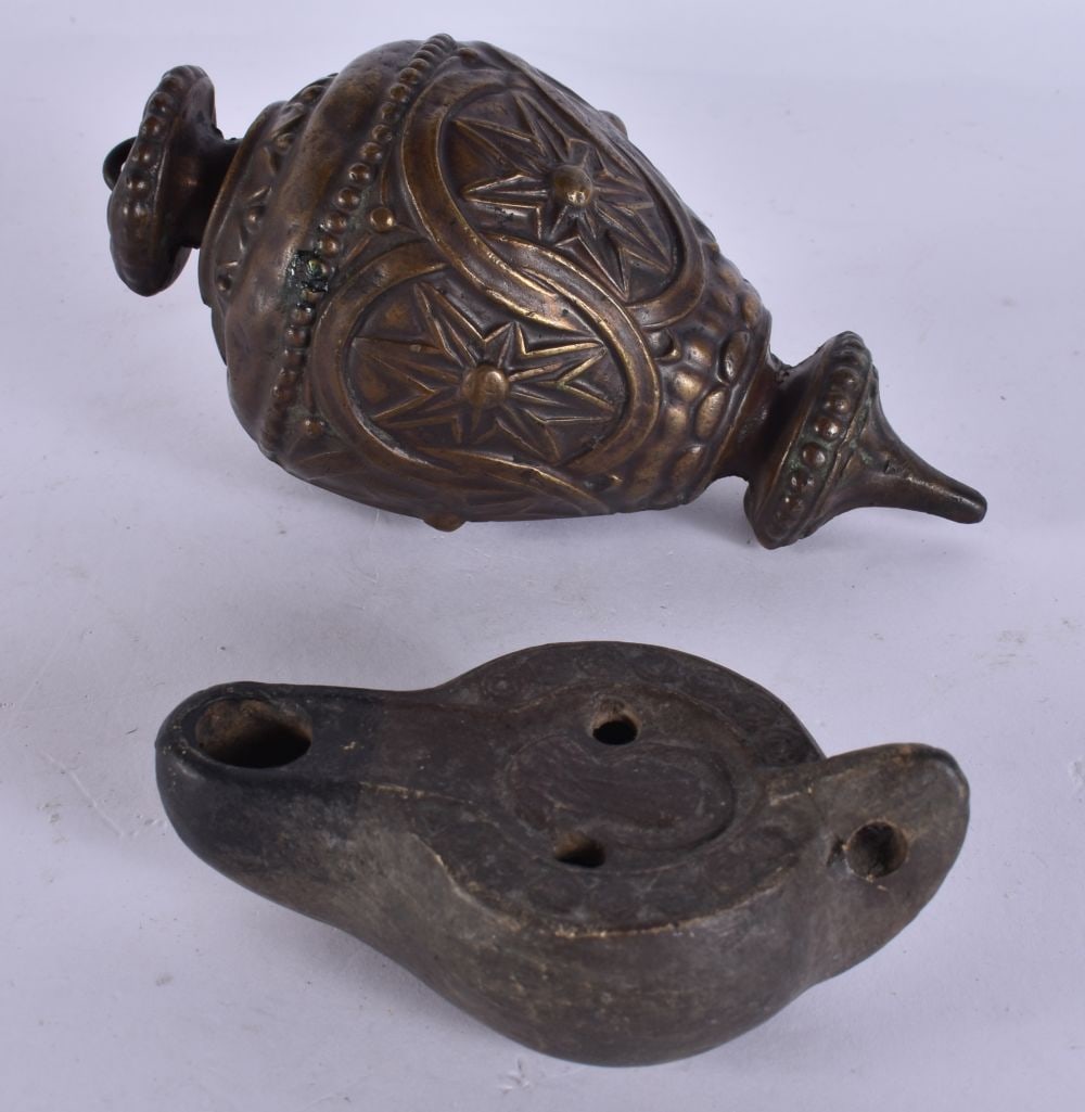 AN ANTIQUE PLUMB WEIGHT together with an oil lamp. (2) (1 of 6)