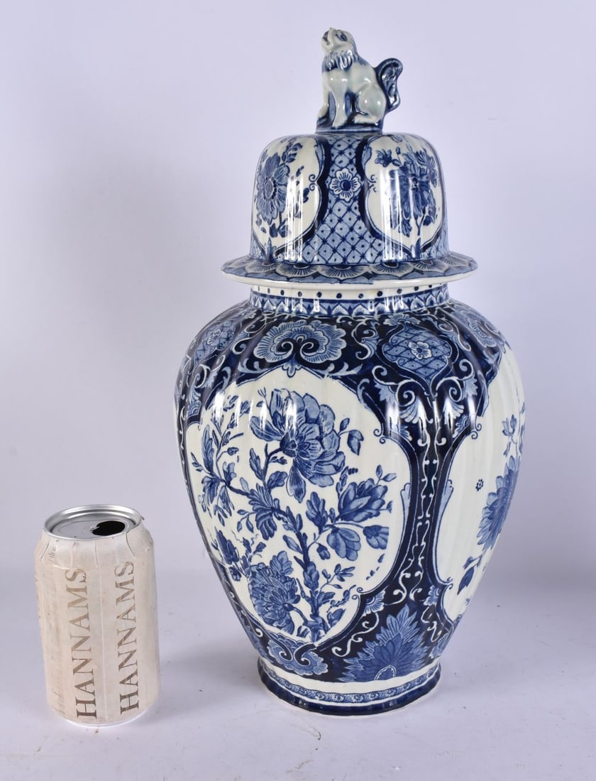 A DUTCH DELFT BLUE AND WHITE POTTERY VASE AND COVER. 39 cm high. (1 of 5)