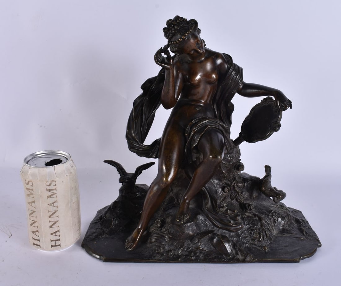 A 19TH CENTURY FRENCH BRONZE FIGURE OF A NUDE FEMALE modelled upon a naturalistic base. 29 cm x 25 c: A 19TH CENTURY FRENCH BRONZE FIGURE OF A NUDE FEMALE modelled upon a naturalistic base. 29 cm x 25 cm.