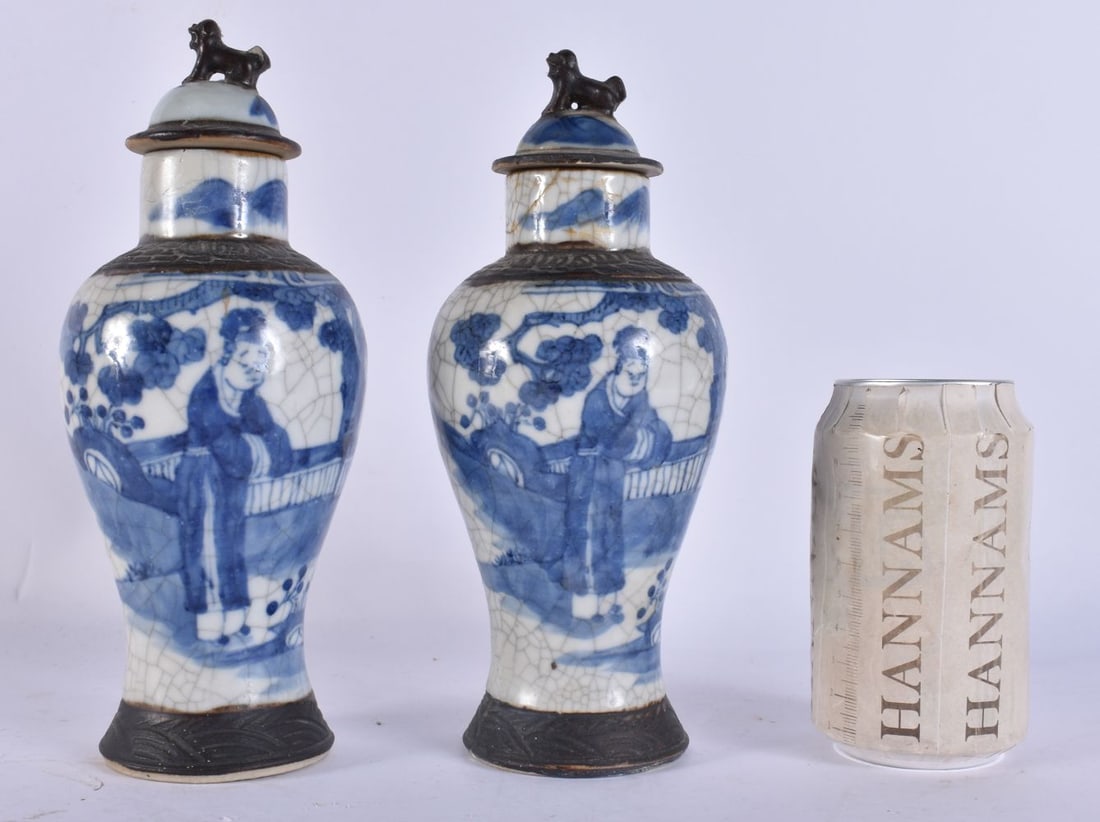 A PAIR OF 19TH CENTURY CHINESE BLUE AND WHITE VASES AND COVERS Late Qing. 23.5 cm high. (1 of 7)