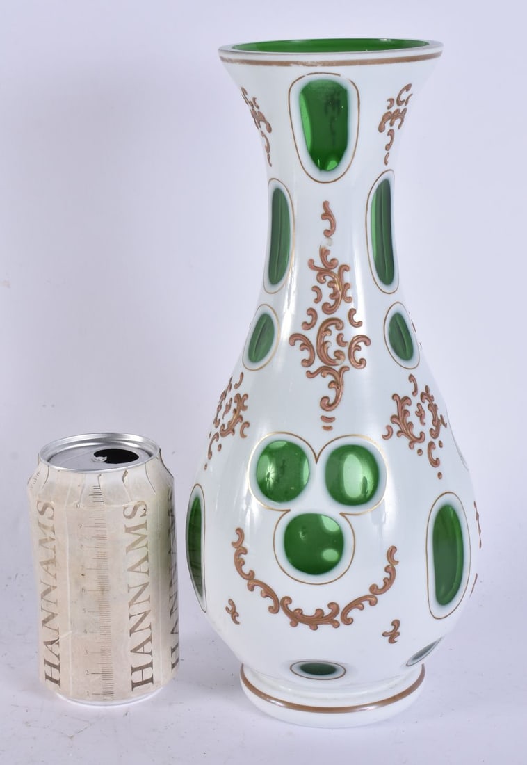 A BOHEMIAN ENAMELLED GREEN GLASS VASE. 29 cm high. (1 of 4)