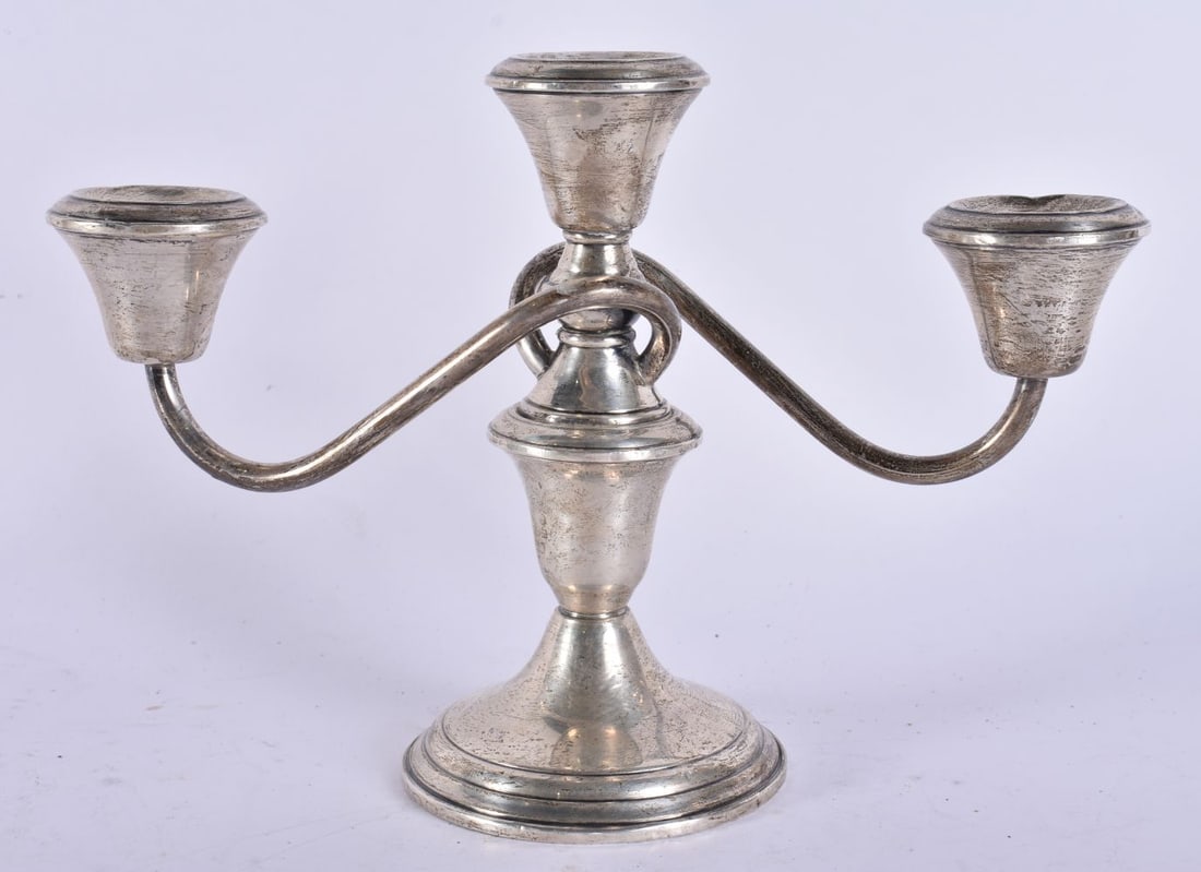 A SILVER CANDELABRA. 532 grams overall. 15 cm high. (1 of 6)