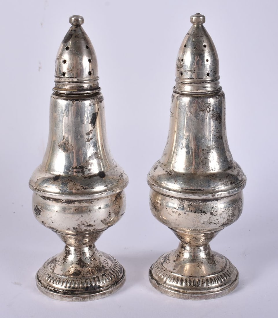 A PAIR OF SILVER CONDIMENTS. 380 grams overall. 12 cm high. (1 of 4)