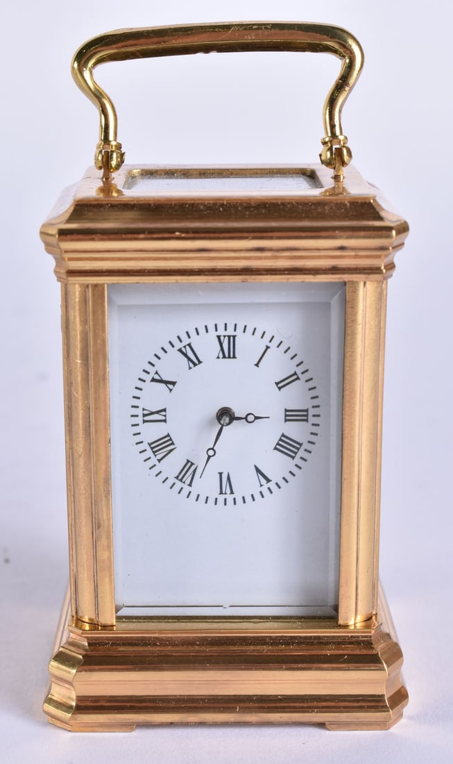 A MINIATURE CARRIAGE CLOCK. 9.5 cm high inc handle. (1 of 6)