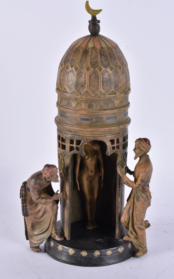 A COLD PAINTED BRONZE EROTIC GROUP. 32 cm high.: A COLD PAINTED BRONZE EROTIC GROUP. 32 cm high.