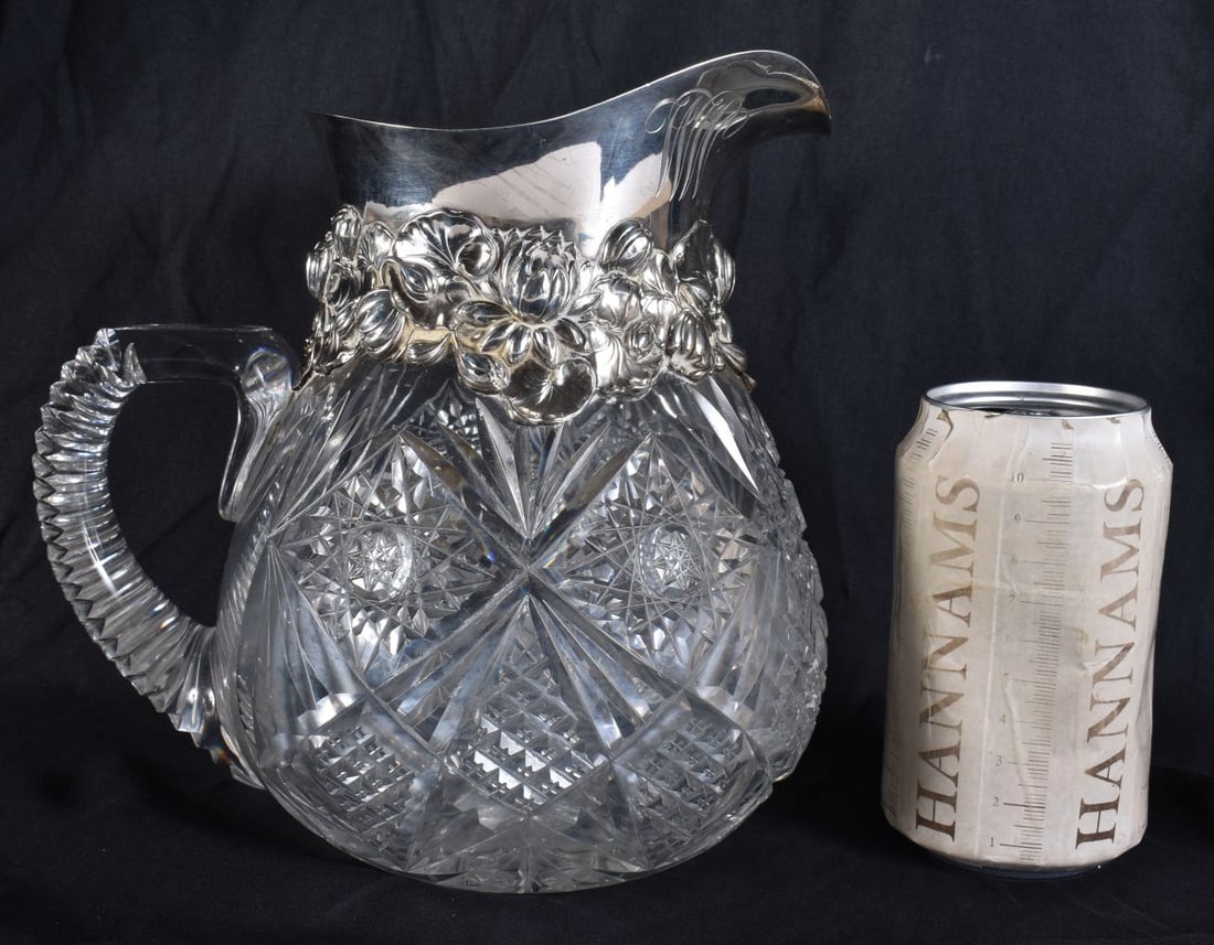 A SILVER MOUNTED CUT GLASS JUG. 22 cm x 15 cm. (1 of 6)