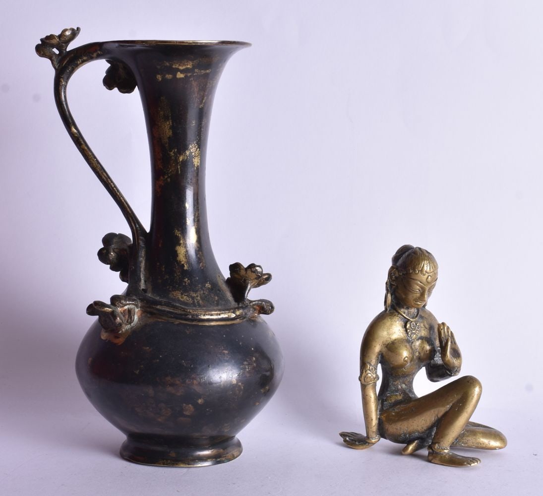AN ANTIQUE INDIAN BRONZE together with a bronze jug. Largest 21 cm high. (2) (1 of 5)