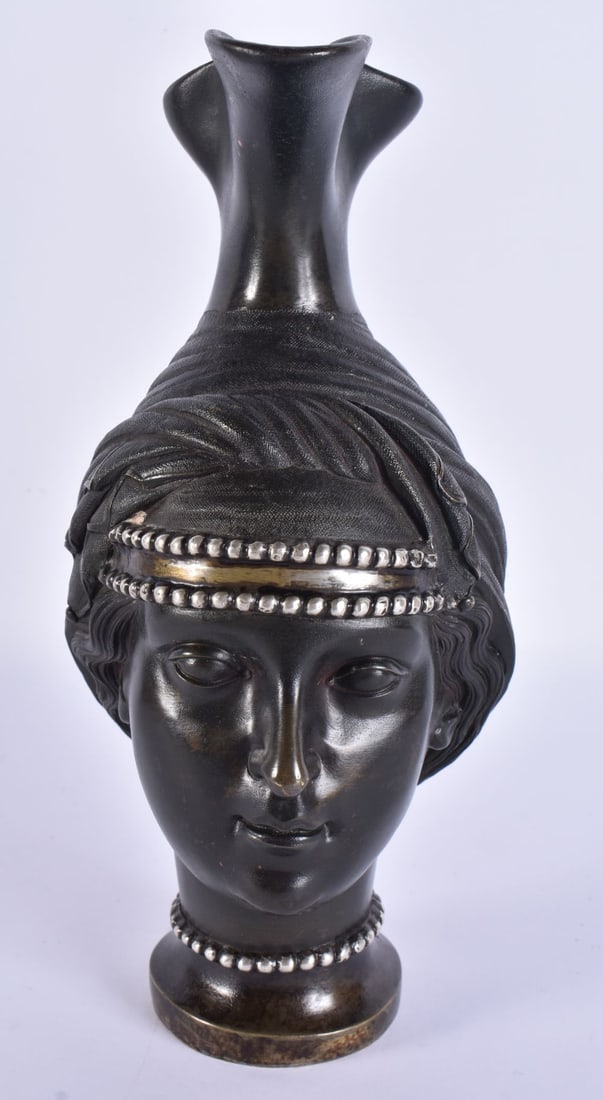 A 19TH CENTURY EUROPEAN GRAND TOUR BRONZE AND SILVER OVERLAY EWER formed as a female mask head. 25 c (1 of 7)