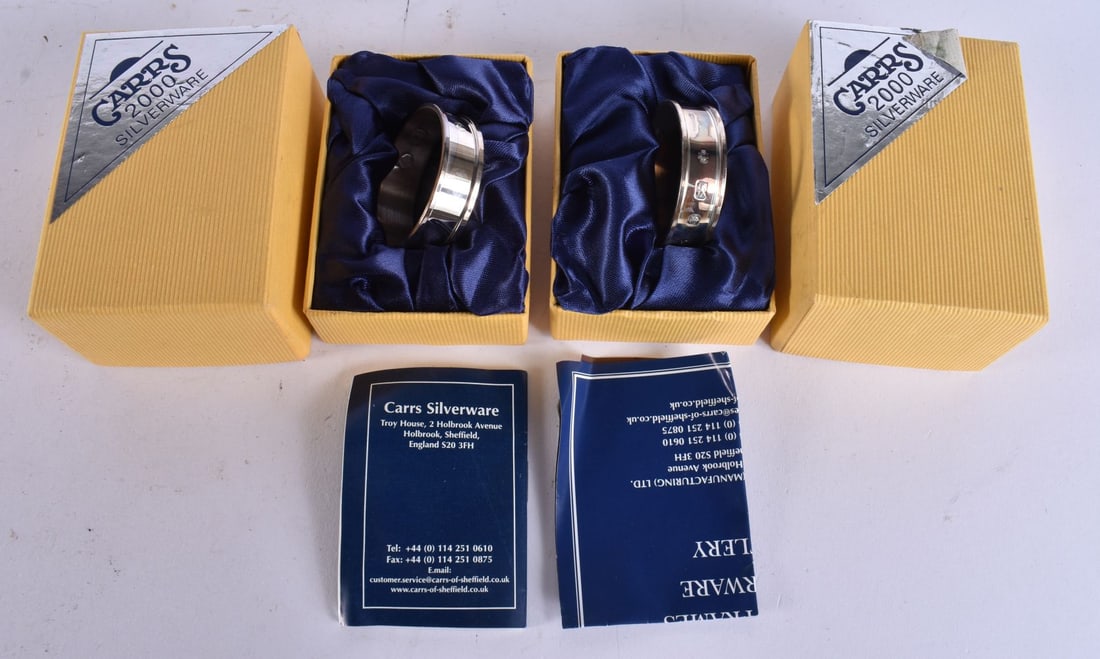 A BOXED PAIR OF CARRS SILVER NAPKIN RINGS. 26.5 grams. 12.5 cm wide. (1 of 4)