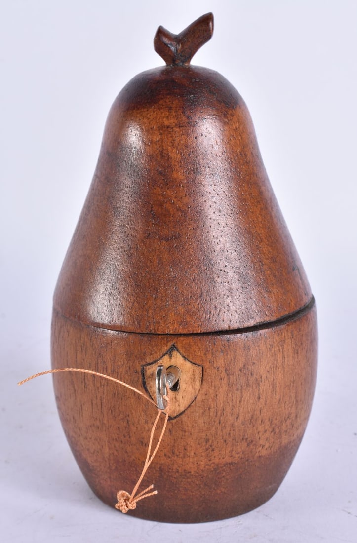 A TREEN CARVED WOOD TEA CADDY. 20 cm high. (1 of 5)
