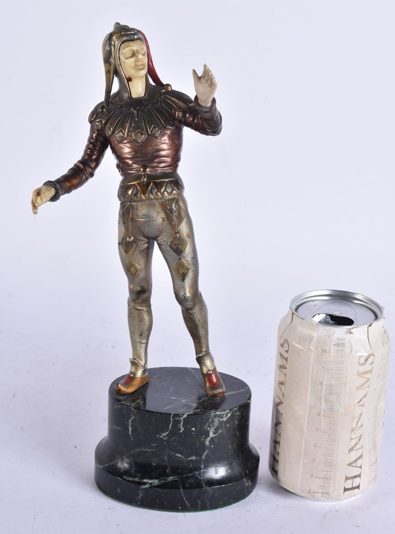 AN ART DECO COLD PAINTED SPELTER FIGURE OF A JESTER. 30 cm high. (1 of 6)
