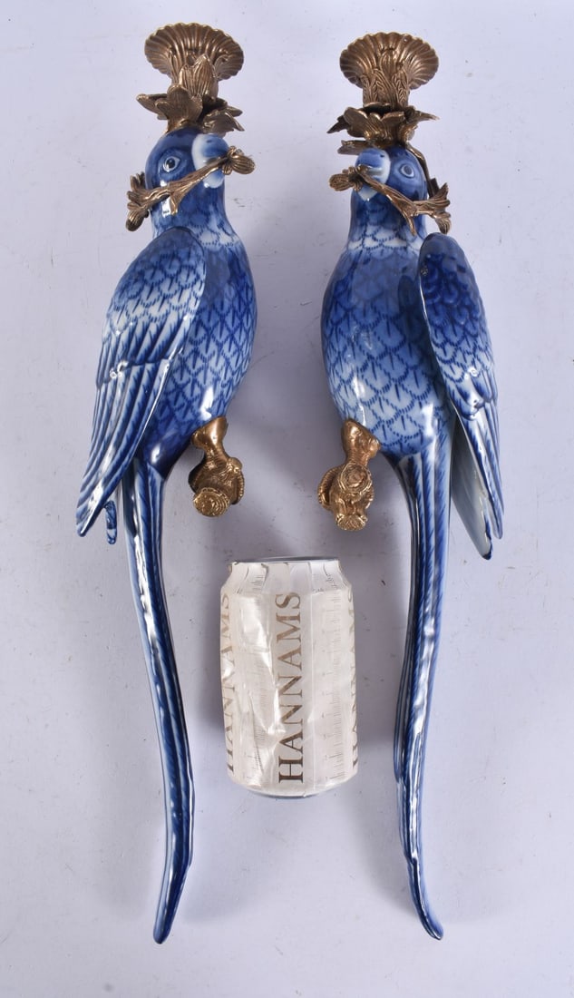 A PAIR OF CONTINENTAL BRONZE PARROT POTTERY CANDLESTICKS. 50 cm long.: A PAIR OF CONTINENTAL BRONZE PARROT POTTERY CANDLESTICKS. 50 cm long.