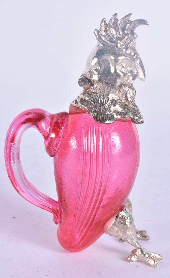 A MINIATURE SILVER PLATED RUBY GLASS PARROT JUG. 13 cm high.: A MINIATURE SILVER PLATED RUBY GLASS PARROT JUG. 13 cm high.