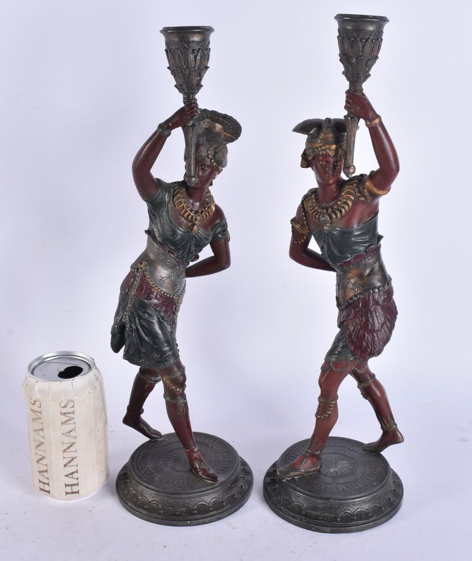 A PAIR OF COLD PAINTED NATIVE AMERICAN FIGURAL CANDLESTICKS. 38 cm high. (1 of 6)