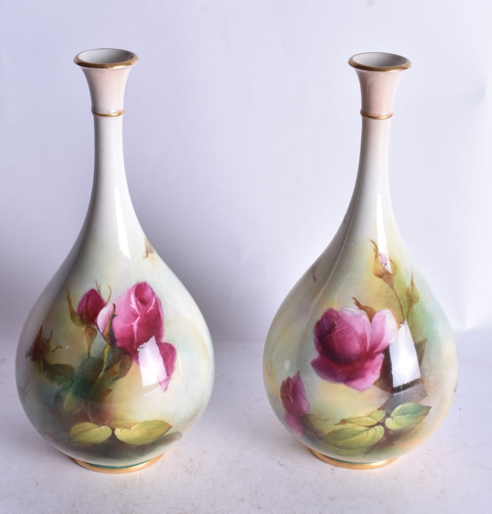 Royal Worcester pair of vases of teardrop shape painted with Hadley style roses by A. Hood, signed d: Royal Worcester pair of vases of teardrop shape painted with Hadley style roses by A. Hood, signed date mark 1909. 23 cm height (pr)