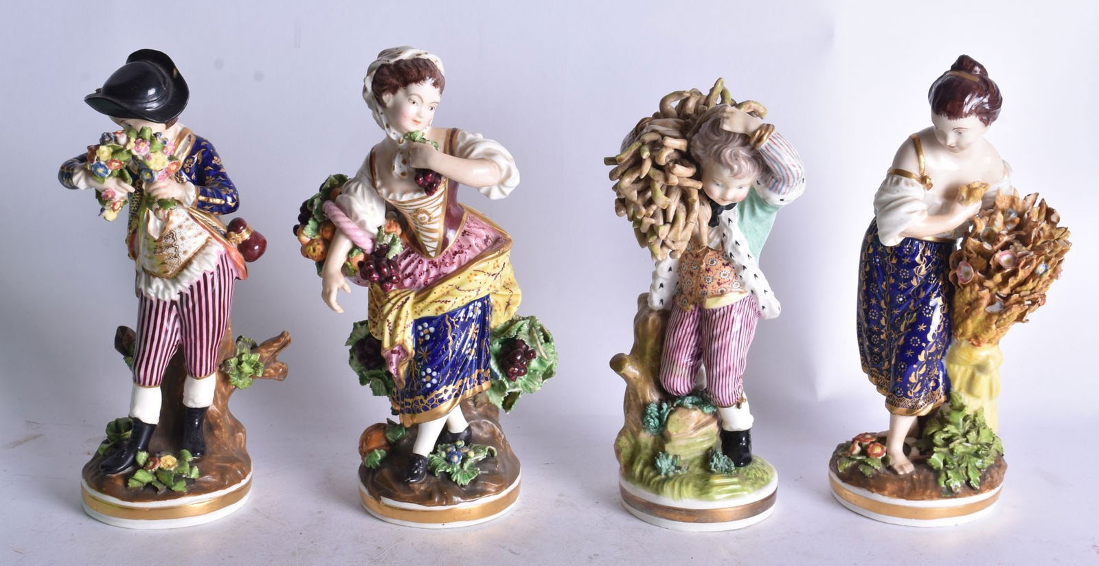 Early 19th century set of Derby figures of the four seasons, Winter with sticks, the Spring with flo (1 of 3)