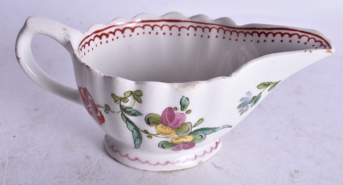 18th century Bow butterboat painted with coloured flowers under a dot and loop border. 11cm width (1 of 3)