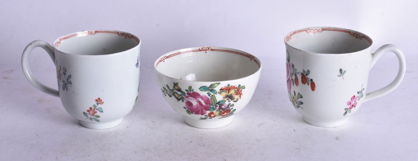 18th century Liverpool pair of coffee cup painted with matching rose sprays, the interior with a red (1 of 3)