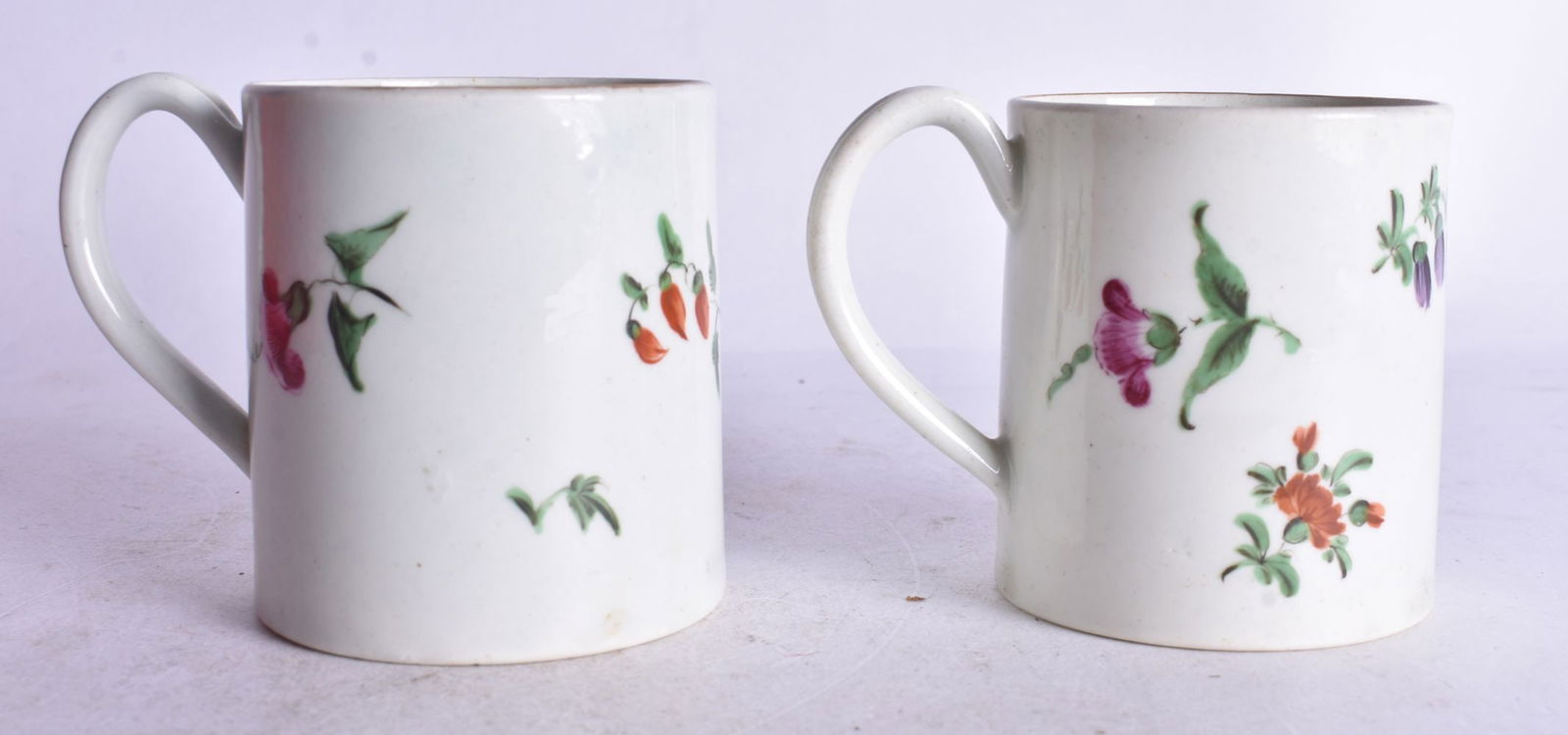 18th century Worcester near pair of coffee cans painted with flower sprays, 6.5cm high: 18th century Worcester near pair of coffee cans painted with flower sprays, 6.5cm high