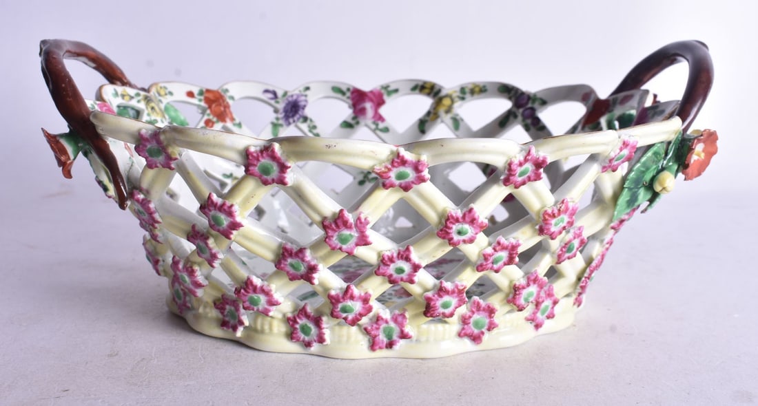 18th century Worcester yellow ground basket with twig handles painted with flowers to the centre and (1 of 3)