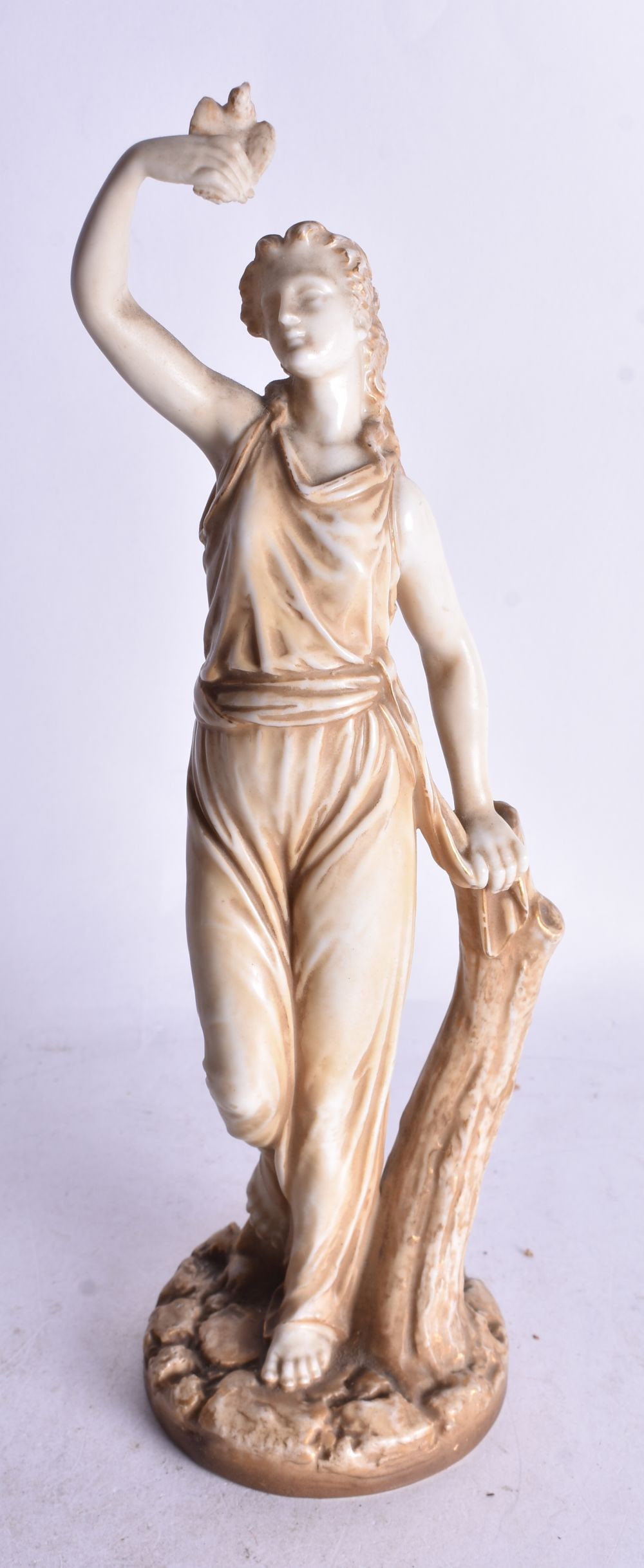 Royal Worcester figure of Liberty, a woman holding a bird aloft date mark 1912. 25cm height (1 of 3)