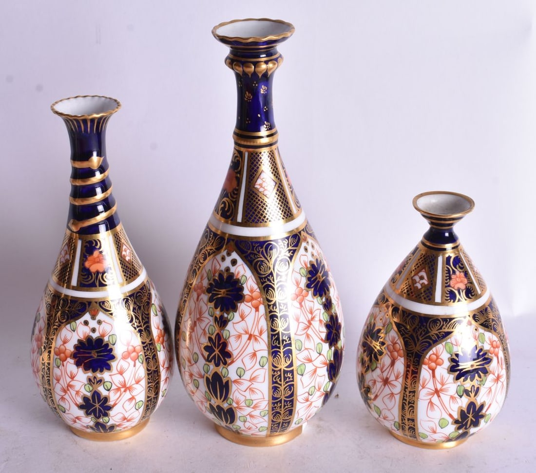 Royal Crown Derby set of three imari vases of teardrop shape painted with pattern 1128, 19cm high (1 of 3)