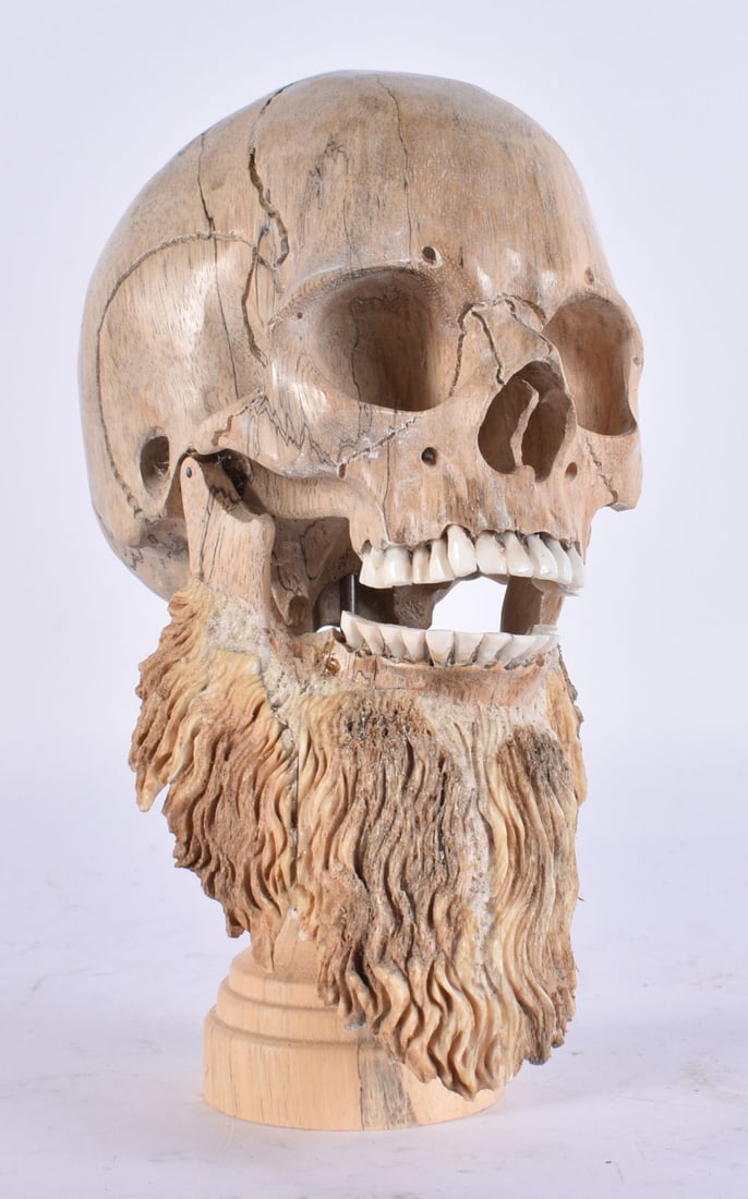 A MEMENTO MORI CARVED WOOD AND ANTLER HORN SKULL. 17 cm high. (1 of 4)