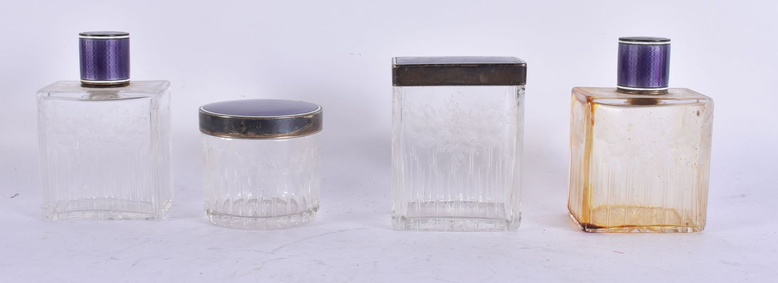 FOUR ART DECO SILVER AND ENAMEL DRESSING TABLE JARS AND COVERS. Largest 9 cm x 6 cm. (4) (1 of 2)