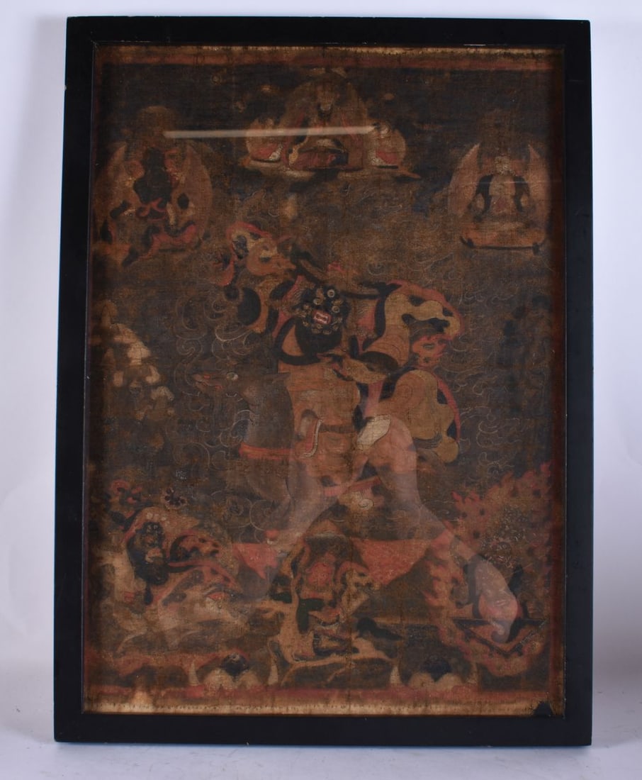 A 17TH/18TH CENTURY TIBETAN THANGKA painted on linen, depicting an aggressive deity with others. 58 (1 of 8)