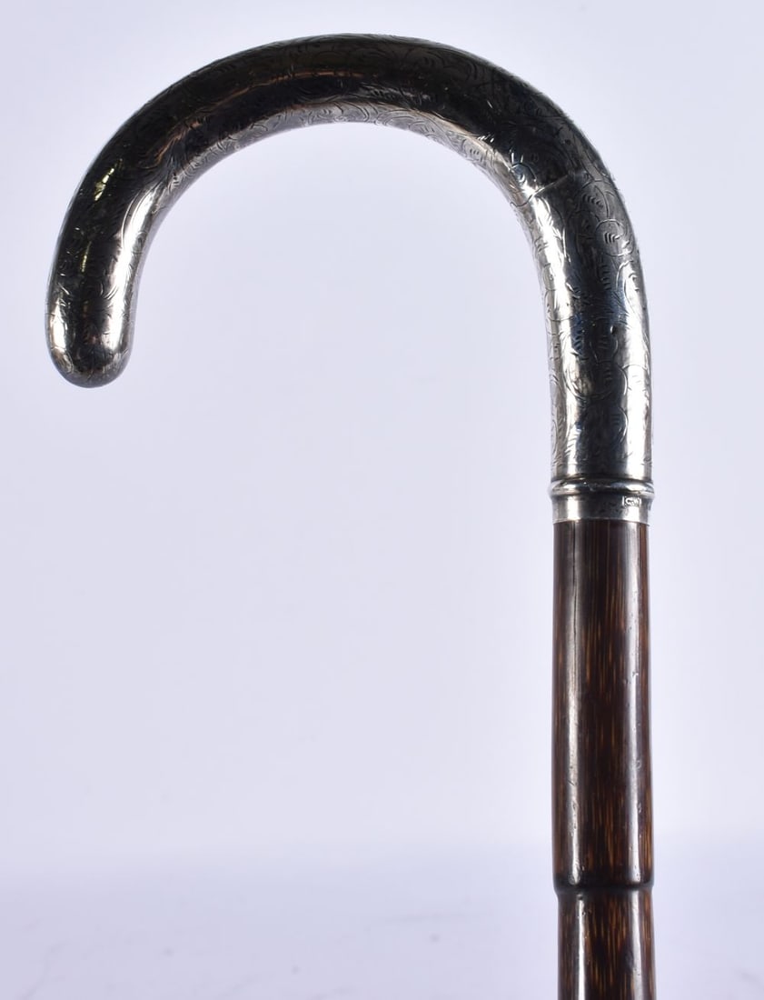 A SILVER MOUNTED WALKING CANE. 90 cm long. (1 of 3)