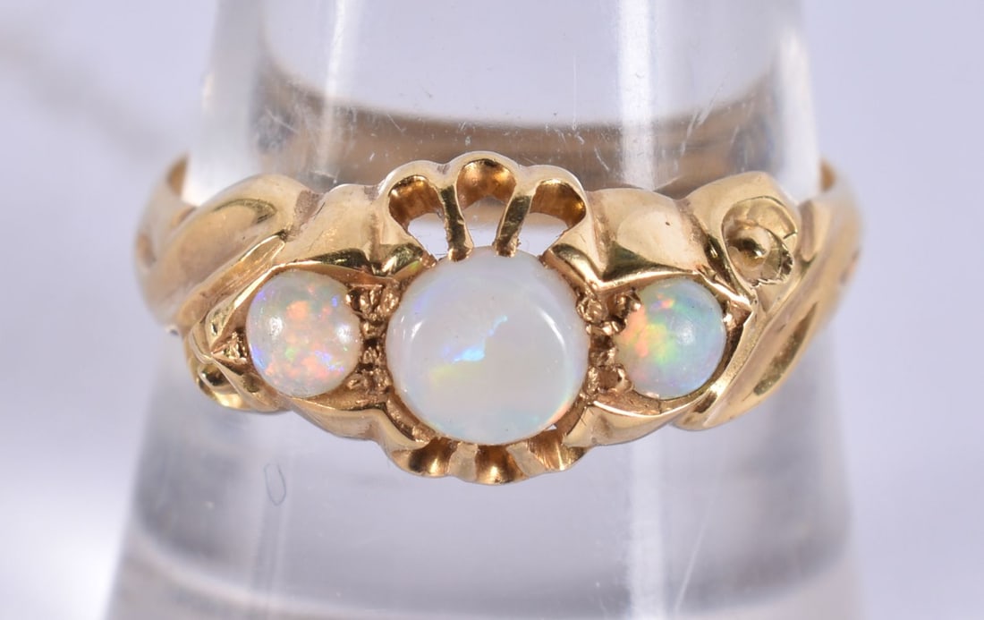 AN 18CT GOLD AND OPAL RING. 3.3 grams. P. (1 of 3)
