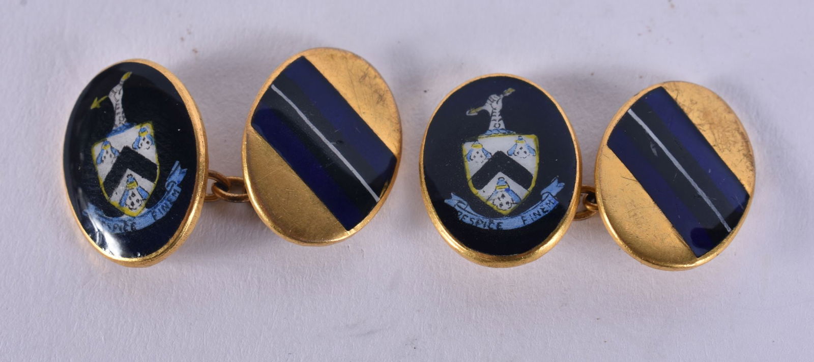 A PAIR OF ANTIQUE YELLOW METAL AND ENAMEL CUFFLINKS. 11 grams. 2 cm x 1.5 cm. (1 of 2)
