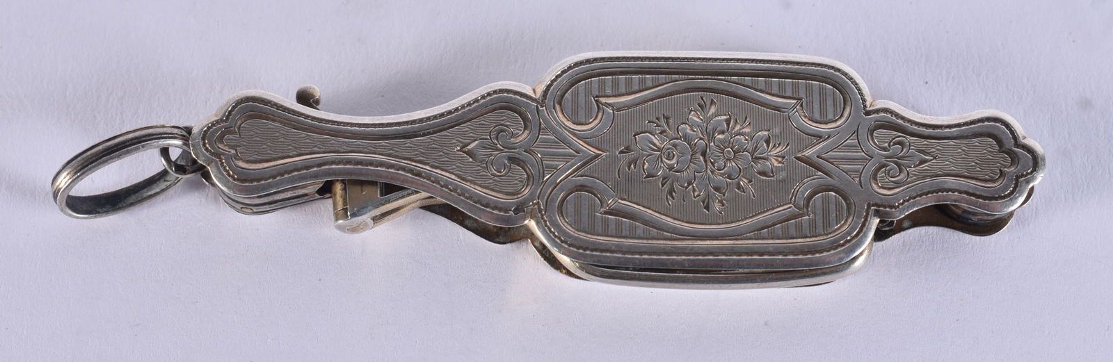 A PAIR OF WHITE METAL LORGNETTES. 19.4 grams. 11 cm long extended. (1 of 2)