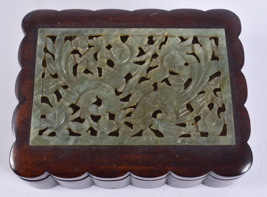 A CHINESE QING DYNASTY CARVED GREEN JADE RETICULATED BOX AND COVER. 12 cm x 9.5 cm. (1 of 6)
