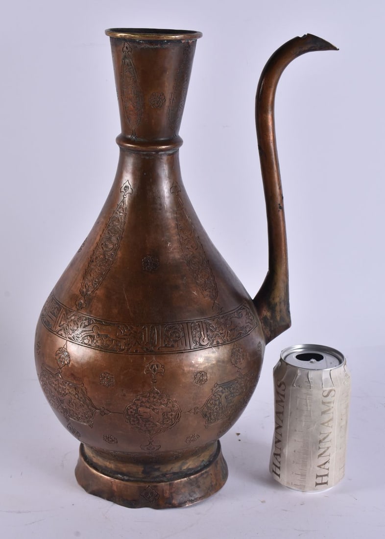 A 19TH CENTURY MIDDLE EASTERN PERSIAN ISLAMIC EWER decorated with panels of animals and scripture. 3 (1 of 7)
