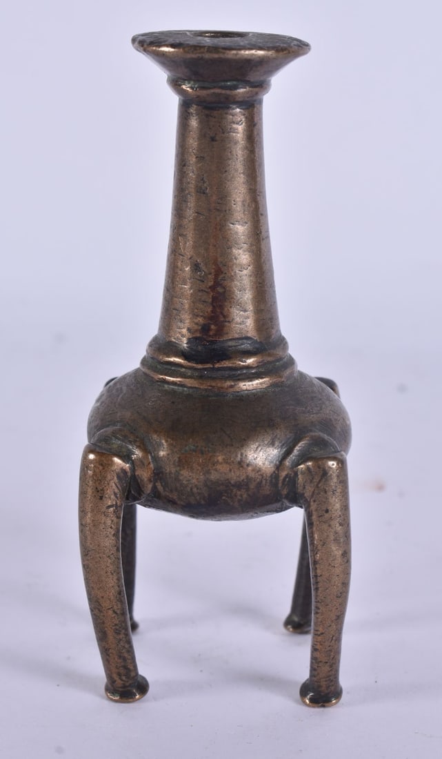 AN EARLY ISLAMIC PERSIAN BRONZE FOUR FOOTED INCENSE BURNER. 10 cm high.: AN EARLY ISLAMIC PERSIAN BRONZE FOUR FOOTED INCENSE BURNER. 10 cm high.