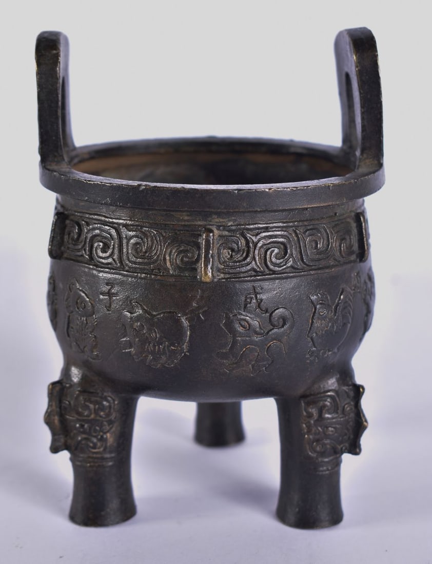 A CHINESE QING DYNASTY TWIN HANDLED BRONZE ZODIAC CENSER decorated with calligraphy. 13 cm x 9 cm. (1 of 5)