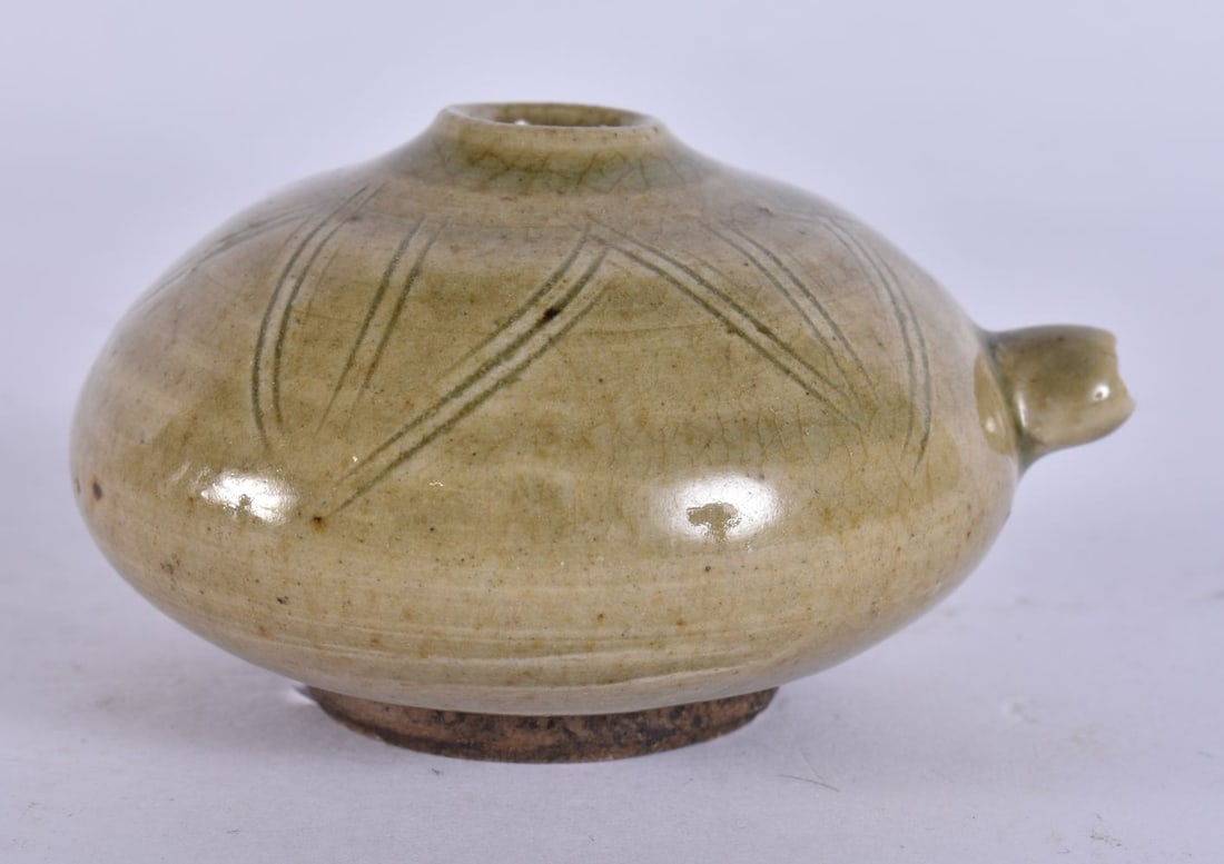 A CHINESE QING DYNASTY OLIVE GREEN GLAZED STONEWARE WATER DROPPER. 7.5 cm wide. (1 of 5)