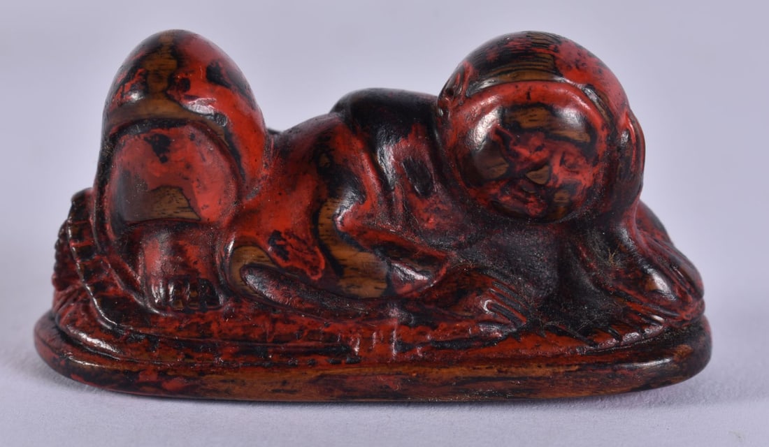 A 19TH CENTURY JAPANESE MEIJI PERIOD NEGORO LACQUERED WOOD NETSUKE. 5.5 cm x 2.5 cm. (1 of 4)