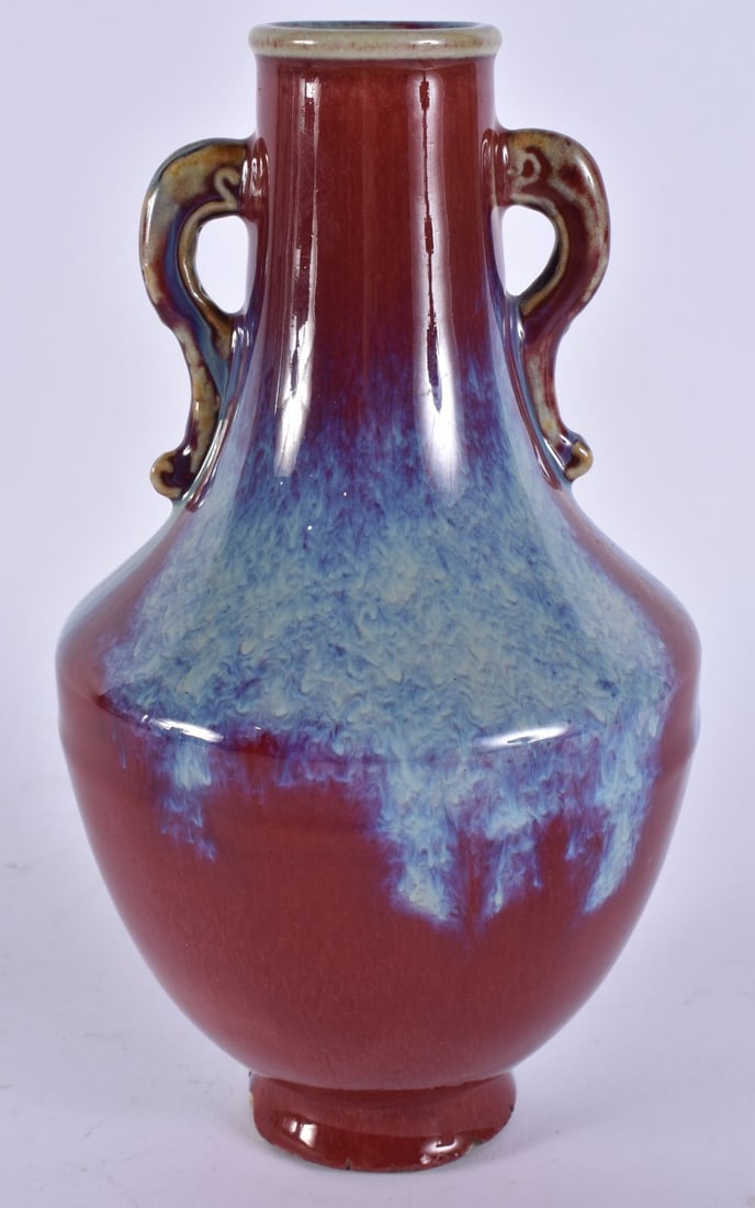 A CHINESE TWIN HANDLED FLAMBE GLAZED VASE. 22 cm high. (1 of 5)