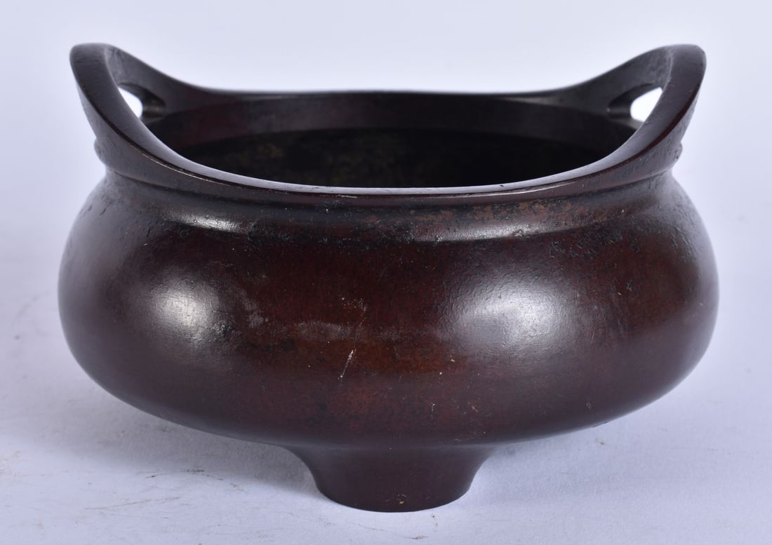 A CHINESE TWIN HANDLED BRONZE CENSER. 12 cm wide, internal width 10 cm. (1 of 5)