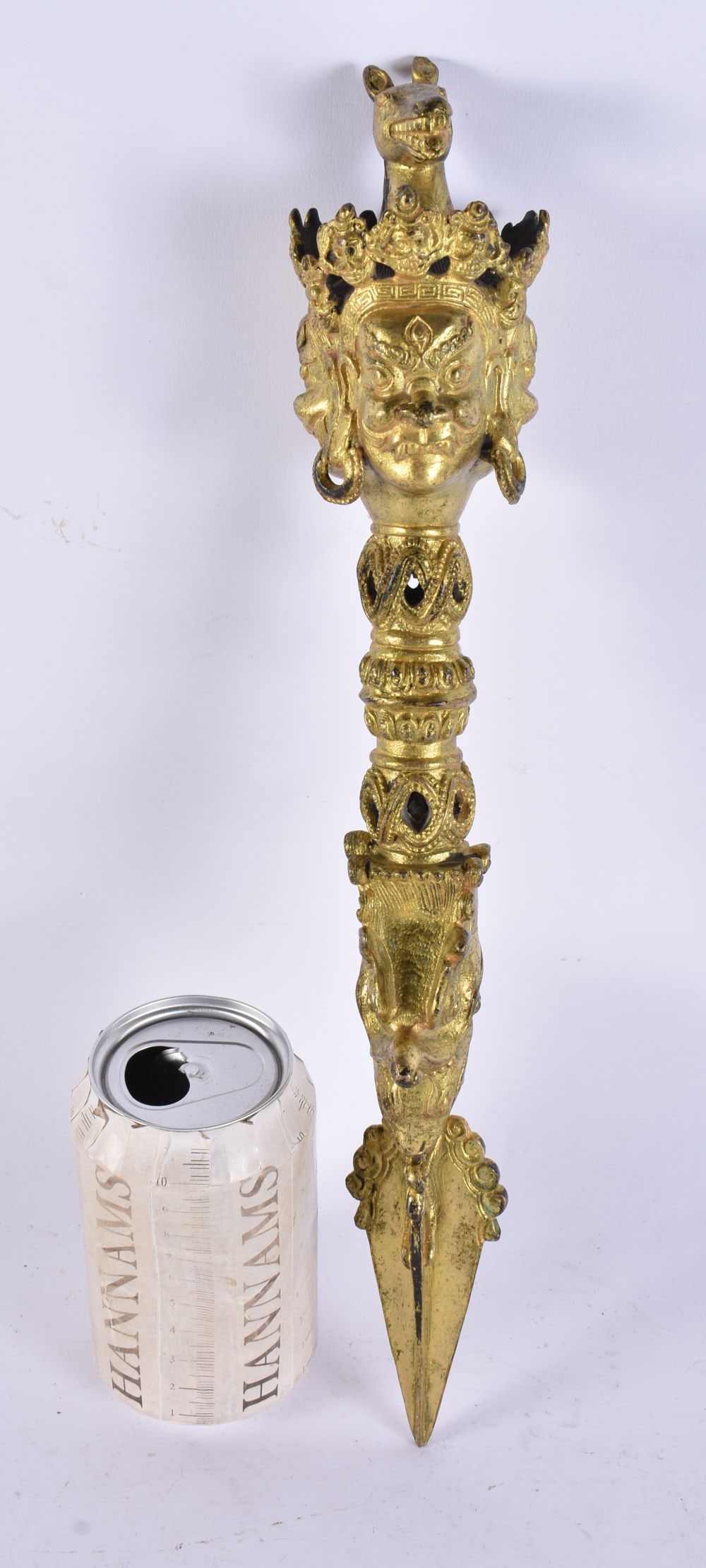 A TIBETAN GILT BRONZE PHURBA. 38 cm long. (1 of 5)