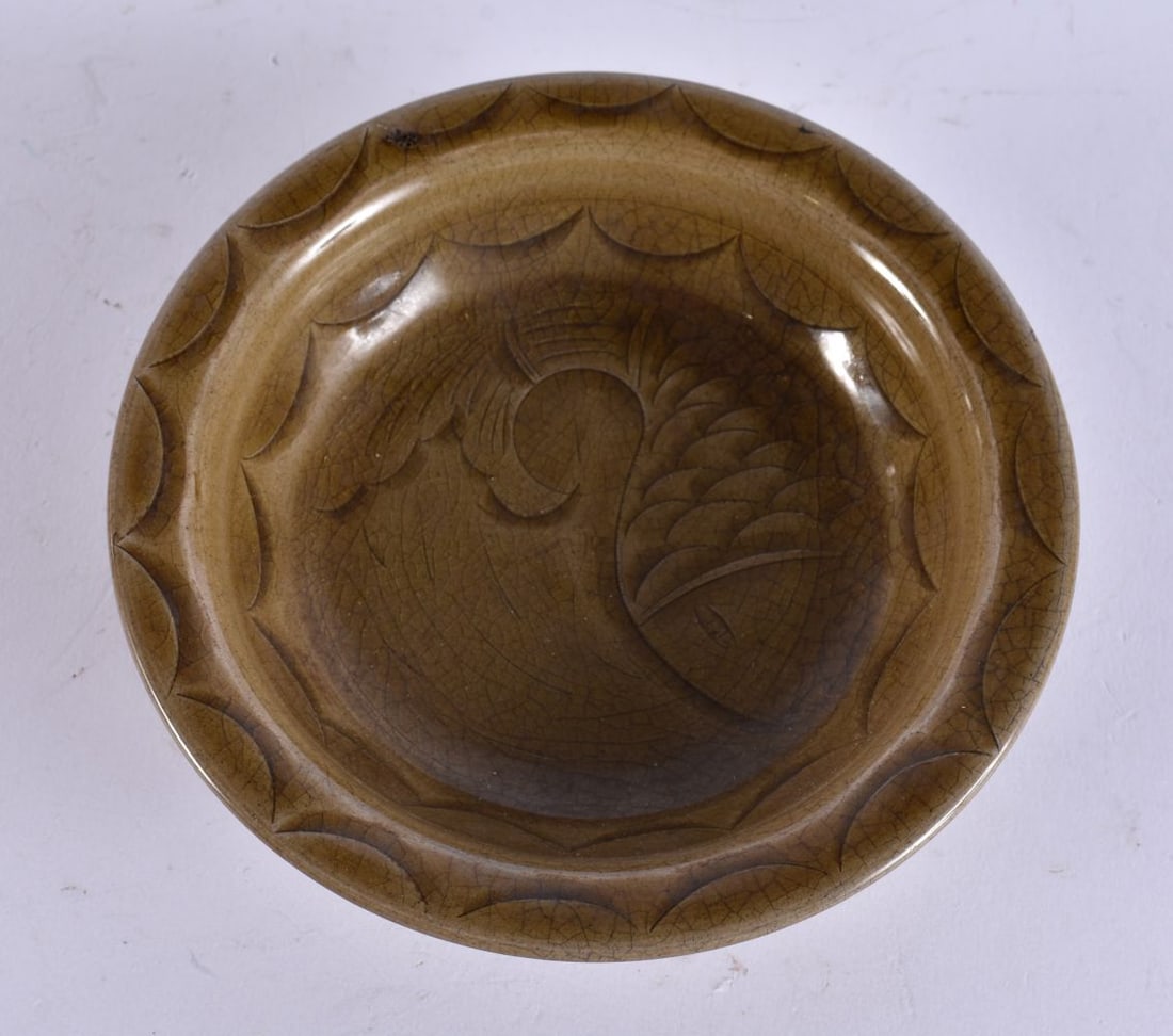 A CHINESE CELADON GLAZED DISH. 11.5 cm diameter. (1 of 4)