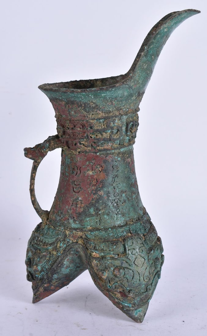A CHINESE BRONZE ARCHAIC VESSEL. 24 cm high. (1 of 5)