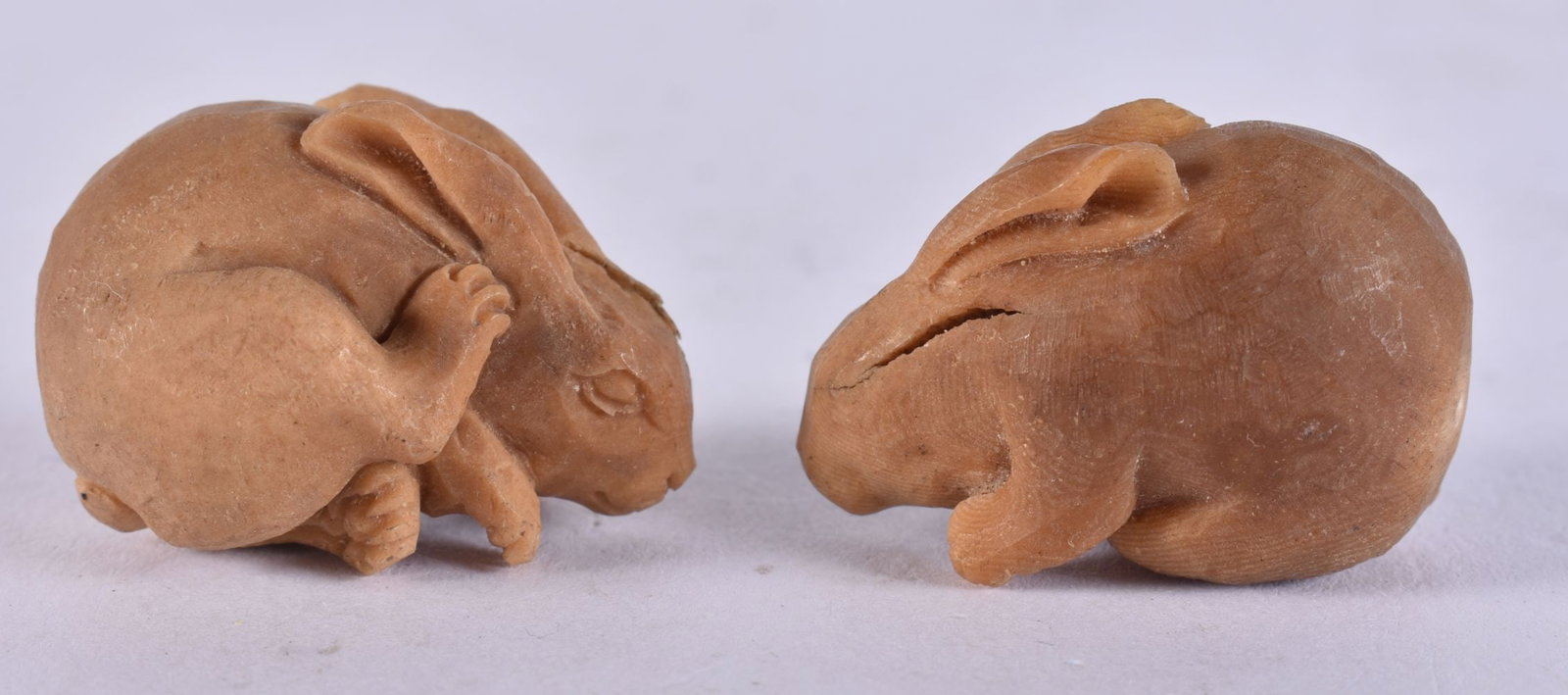 TWO JAPANESE TAGUA NUT RABBITS. 18 grams. 2.25 cm x 3.25 cm. (2) (1 of 4)