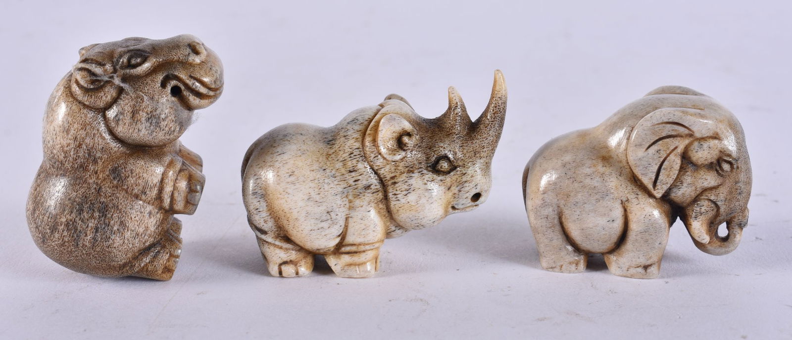 THREE STAG HORN ANIMALS. 60 grams. 5 cm x 3.5 cm. (3): THREE STAG HORN ANIMALS. 60 grams. 5 cm x 3.5 cm. (3)