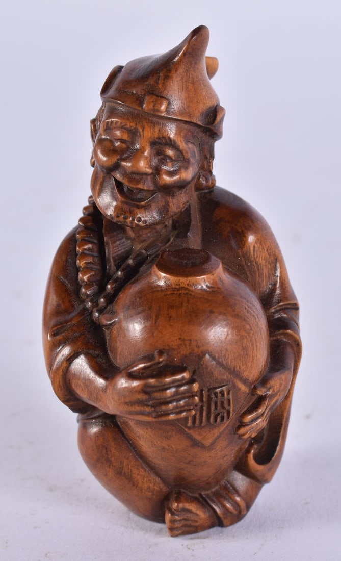 A JAPANESE WOOD MAN. 41 grams. 8 cm x 4 cm. (1 of 4)