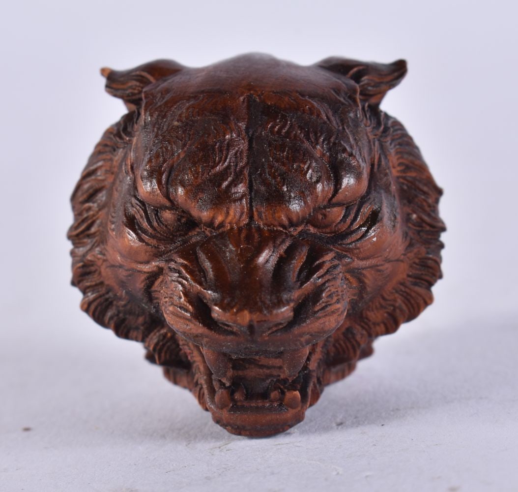 A JAPANESE WOOD TIGER. 12.8 grams. 3 cm x 4 cm. (1 of 4)