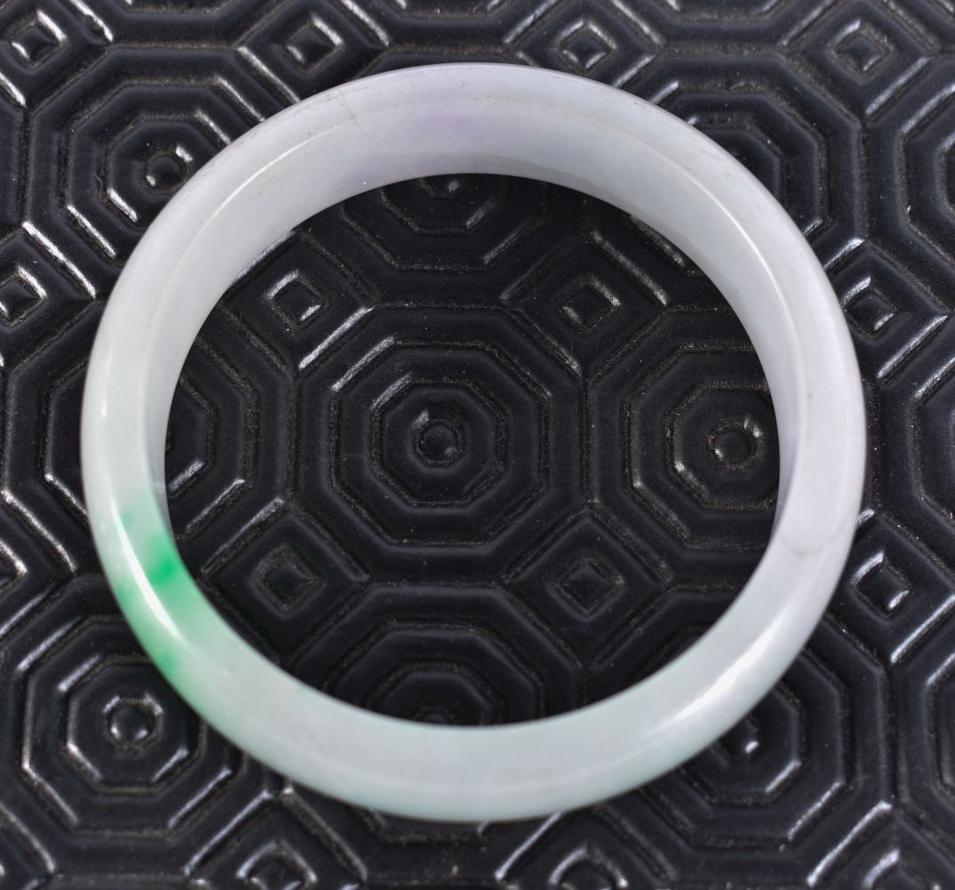 A CHINESE JADE BANGLE. 64 grams. 5.75 cm wide. (1 of 3)